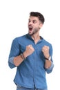 Convinced young man yelling with his fists clenched Royalty Free Stock Photo