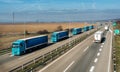 Convoy of Blue Trucks in line on a rural countryside highway