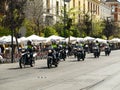 Convoy of Seven Police Motorcyclists Traveling Along a Street in Seville, Spain