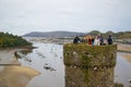 Conwy, Wales; 10/14/2018: Tourists on a tower of Conwy Castle, an ancient 13th Century stone built fortification in North Wales, Royalty Free Stock Photo