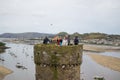 Conwy, Wales; 10/14/2018: Tourists on a tower of Conwy Castle, an ancient 13th Century stone built fortification in North Wales,