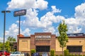 LongHorn Steakhouse building sign with cars and green landscape Royalty Free Stock Photo