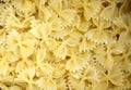 Coocked italian pasta farfalle with oilve oil top view. Texture of Italian pasta macaroni bows farfalle. Carbohydrates food. Royalty Free Stock Photo