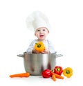 Cook baby inside big pan with healthy food Royalty Free Stock Photo