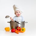 Cook baby inside pan with healthy food Royalty Free Stock Photo
