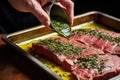 cook basting roasted beef with garlic-herb sauce