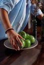 Cook brought apples for use in the kitchen in a restaurant