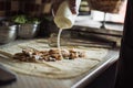 cook chapati. Preparation of traditional shawarma and shawarma doner kebab. A man pours sauce on pita bread with meat and tomato