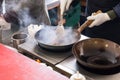 Cook or chef frying in a commercial kitchen Royalty Free Stock Photo