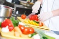 Cook chef hand preparing salad food in kitchen Royalty Free Stock Photo