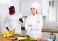 Cook and chef having quarrel in kitchen Royalty Free Stock Photo