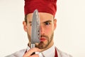 Cook or chef with knife near eye on white background Royalty Free Stock Photo