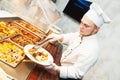 Cook chef serving food