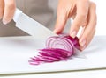 Cook is chopping onion Royalty Free Stock Photo