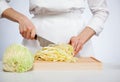 Cook chopping savoy cabbage Royalty Free Stock Photo