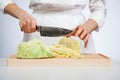 Cook chopping savoy cabbage Royalty Free Stock Photo