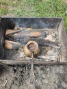 Cook coffee on the coals in nature Royalty Free Stock Photo