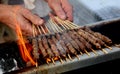 cook cooking of mutton kebabs called ARROSTICINI in italian lang