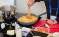 Cook cooking rise with vegetables in a pan Royalty Free Stock Photo