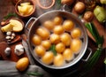 The cook cooks fresh potatoes in a saucepan