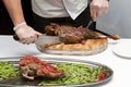 Cook cut up roast lamb leg Royalty Free Stock Photo