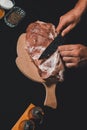 The cook cuts the fat on the neck, prepares the meat for marinating and roasting Royalty Free Stock Photo