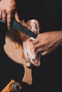 The cook cuts the fat on the neck, prepares the meat for marinating and roasting Royalty Free Stock Photo