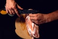 The cook cuts the fat on the neck, prepares the meat for marinating and roasting Royalty Free Stock Photo