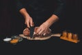 The cook cuts the fat on the neck, prepares the meat for marinating and roasting Royalty Free Stock Photo