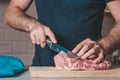 The cook cuts the pork ribs for roasting Royalty Free Stock Photo