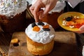 Cook decorates Easter cake with dried fruits