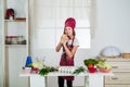 Cook delicious recipe. chef girl in hat and apron. kid cooking food in kitchen. choosing a career. little helper knead Royalty Free Stock Photo