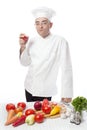 Cook eating red apple Royalty Free Stock Photo