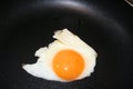 cook one fried egg on pan Royalty Free Stock Photo
