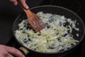 Cook fries onions in a pan