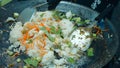 Cook frying vegetables and rice