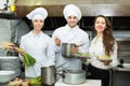 Cook gives to waitress plates Royalty Free Stock Photo