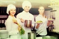 Cook gives to waitress plates Royalty Free Stock Photo