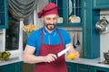 Cook going cut Yellow bell pepper. Chef man cooking vegetables in the kitchen. Man start cutting orange paprika. Royalty Free Stock Photo