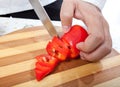 Cook hand with knife cutting vegetable