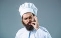 Cook hat. Professional chef man showing sign for delicious. Chef, cook making tasty delicious gesture by kissing fingers Royalty Free Stock Photo