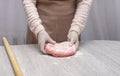 Preparing color dough for pelmeni, ravioli. Mom`s hands