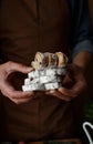 the cook is holding sliced pieces of Christmas stollen in his hands. Royalty Free Stock Photo