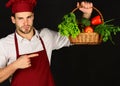 Cook holds fresh vegetables. Healthy cuisine concept.