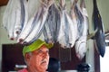 Cook Islander looks at fresh tuna fish at the market in Avarua C