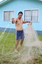 Cook Islander man checks his fishing net