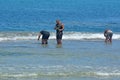 Cook Islander men checks fishing net in Raroronga Cook Islands