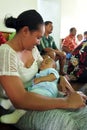 Cook Islander mother holds her baby