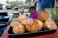 Cook Islander woman sale fresh coconuts