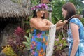 Cook Islander woman welcome a Western tourist woman in Rarotonga Cook Islands